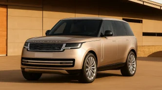 2025 Range Rover in front of modern house.