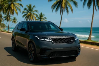 2025 Range Rover Velar Dynamic HSE driving on a scenic Sri Lankan coastal road with visible Range Rover branding.