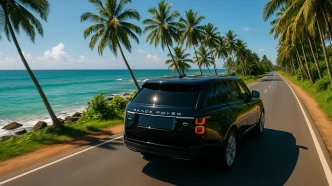 Luxury Range Rover driving along a scenic Sri Lankan coastal road with ocean views and palm trees.